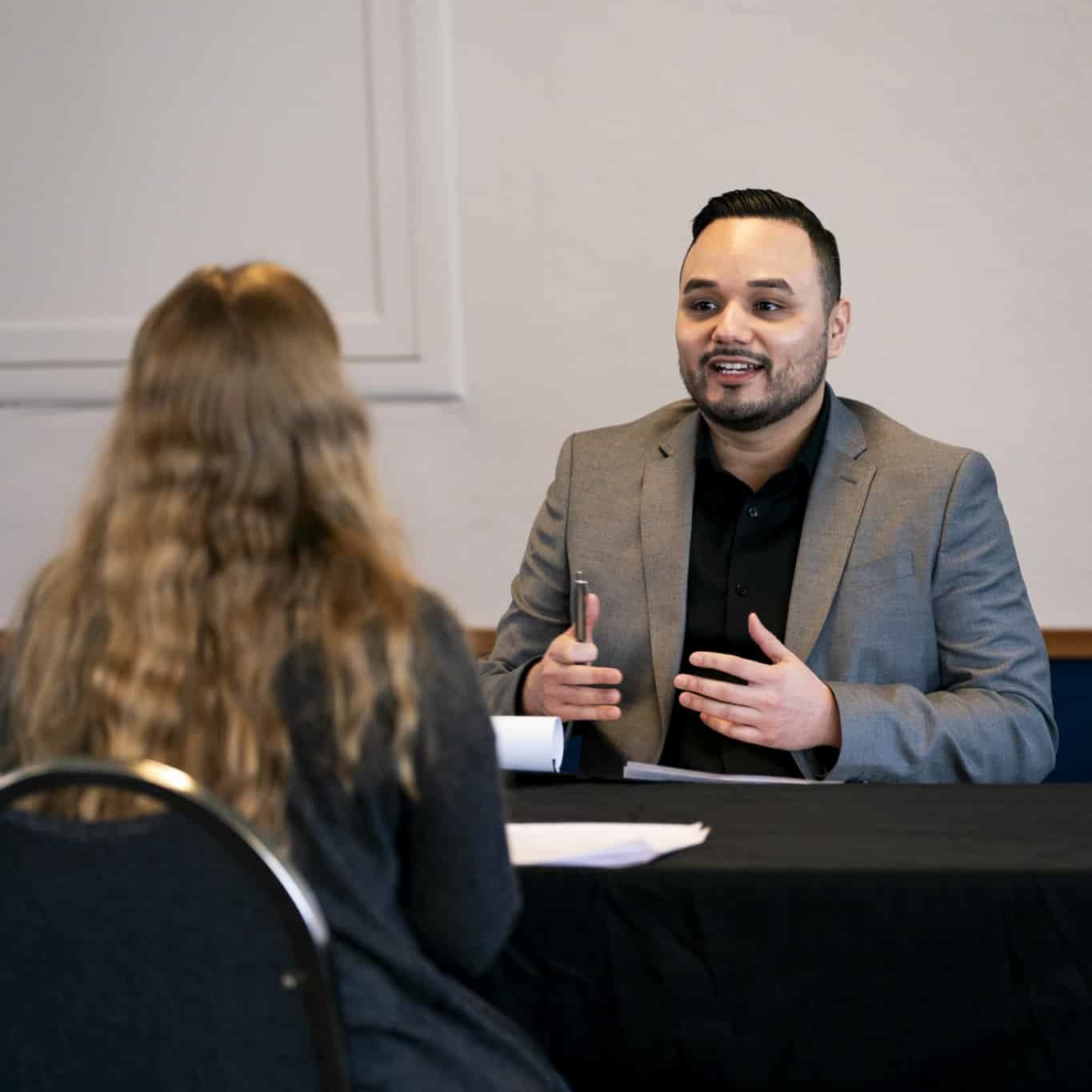 male interviewing a student