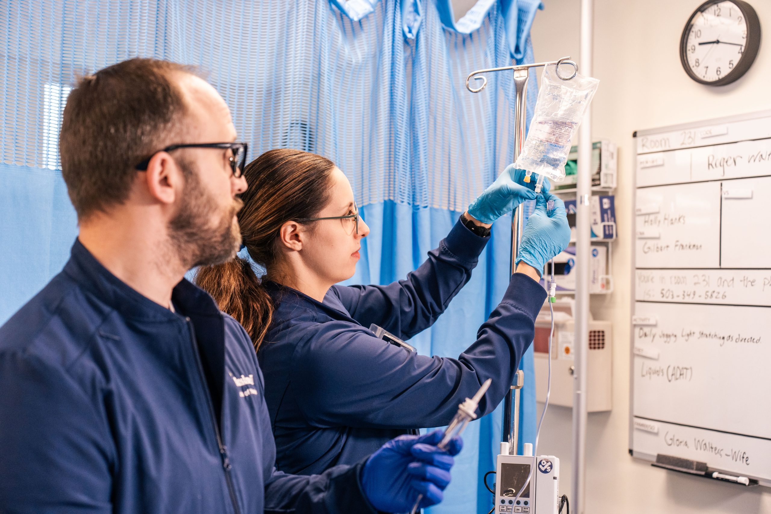 Nursing students work together during a patient care simulation in Bushnell University's nursing skills lab.