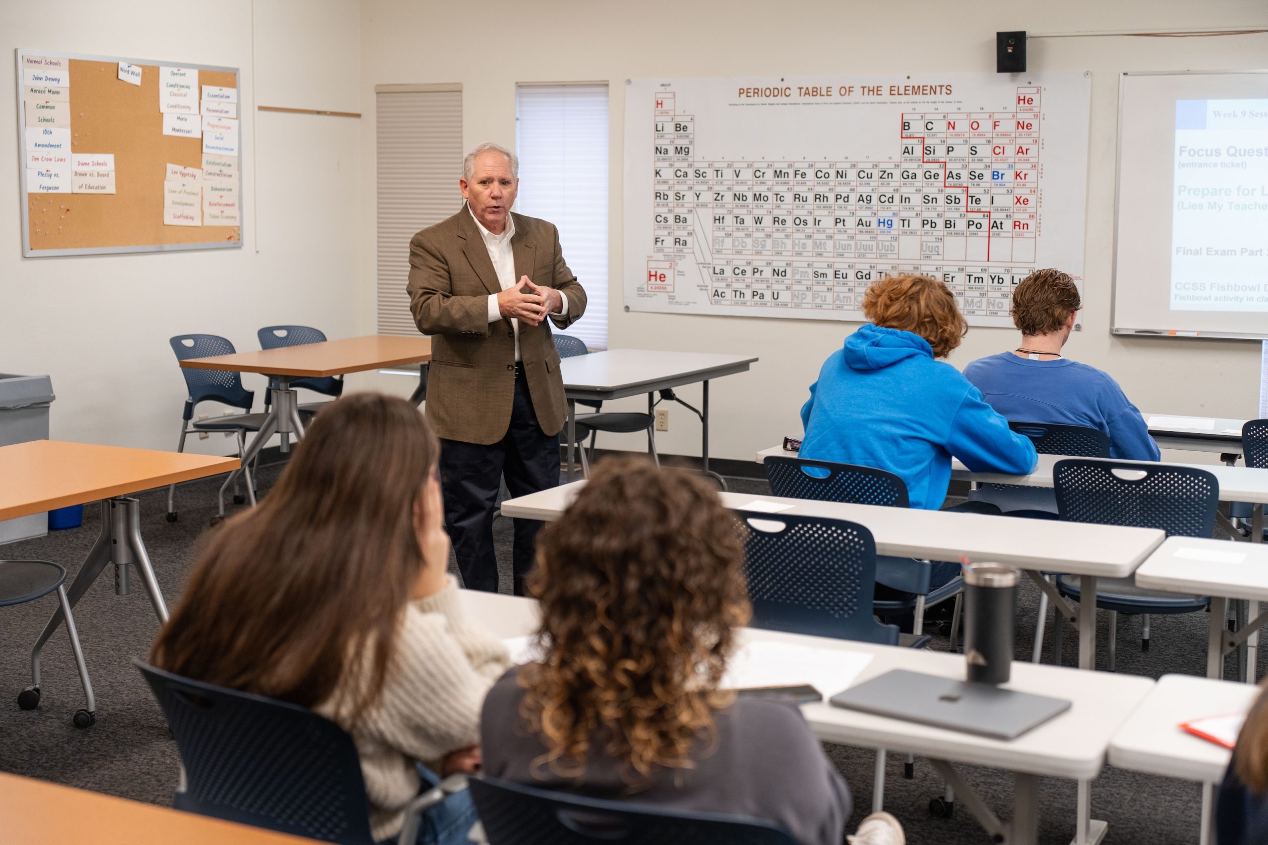 Faculty member teaching students in a Bushnell University classroom.