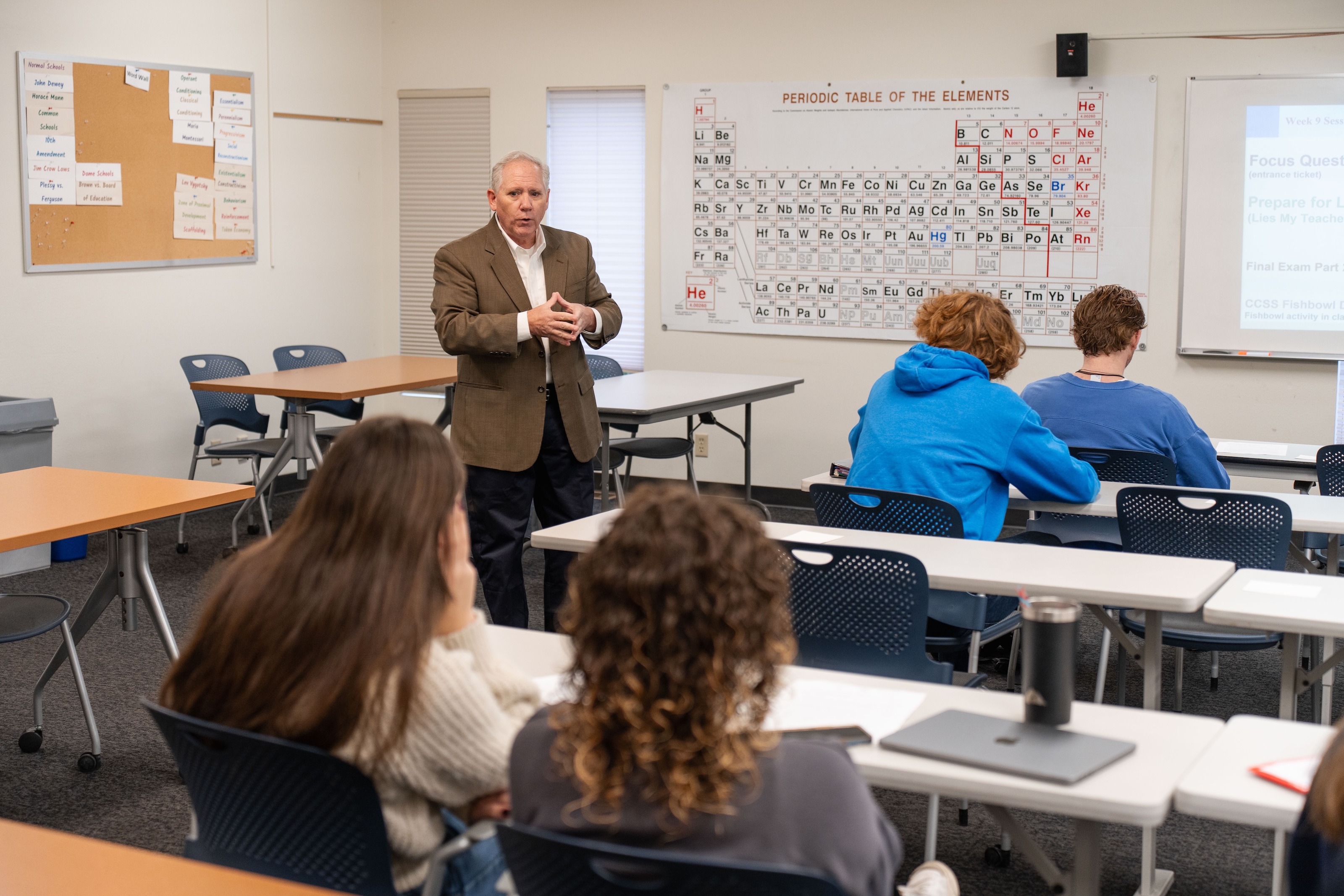 Faculty member teaching students in a Bushnell University classroom.