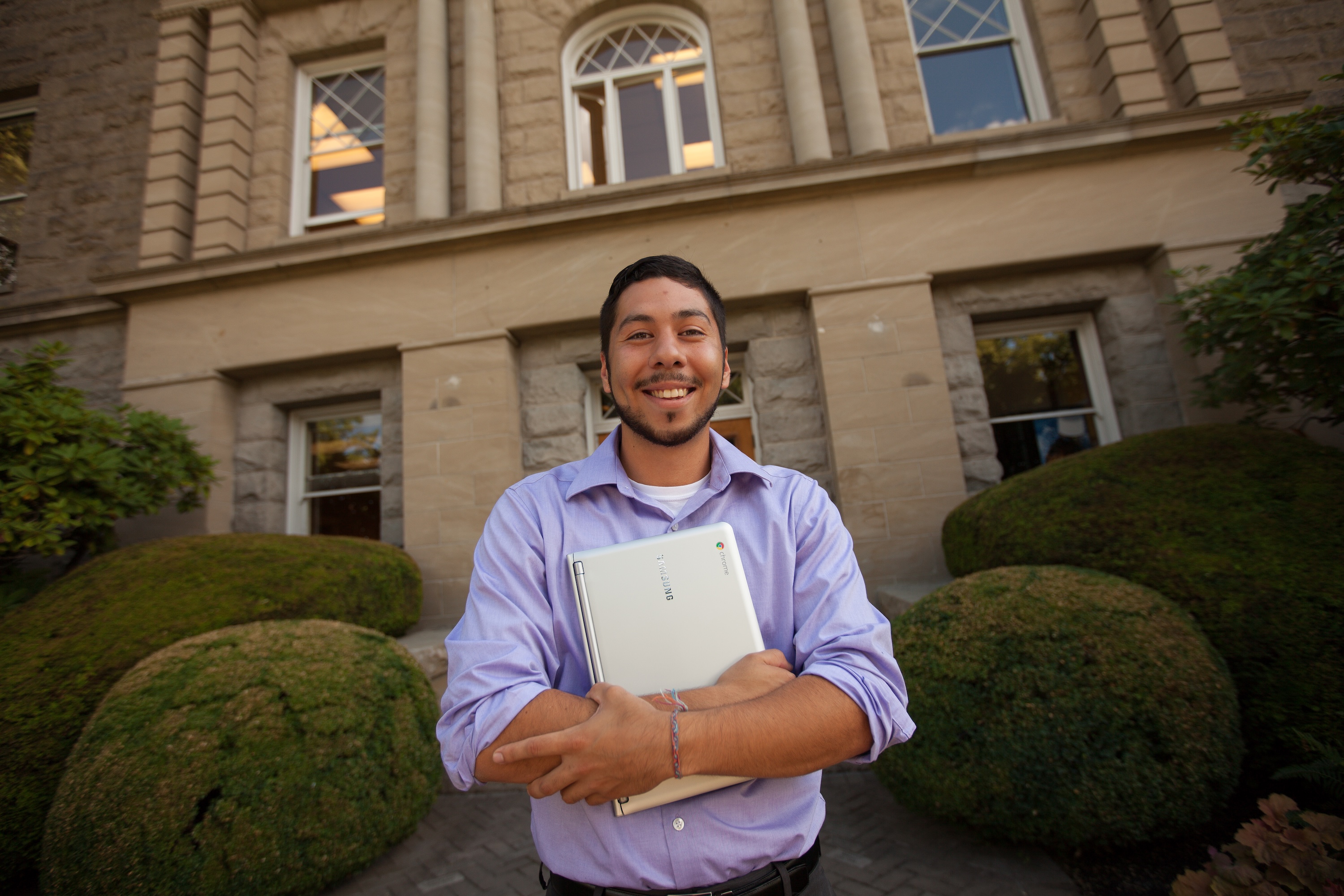 MBA student standing outside on the Bushnell University campus.