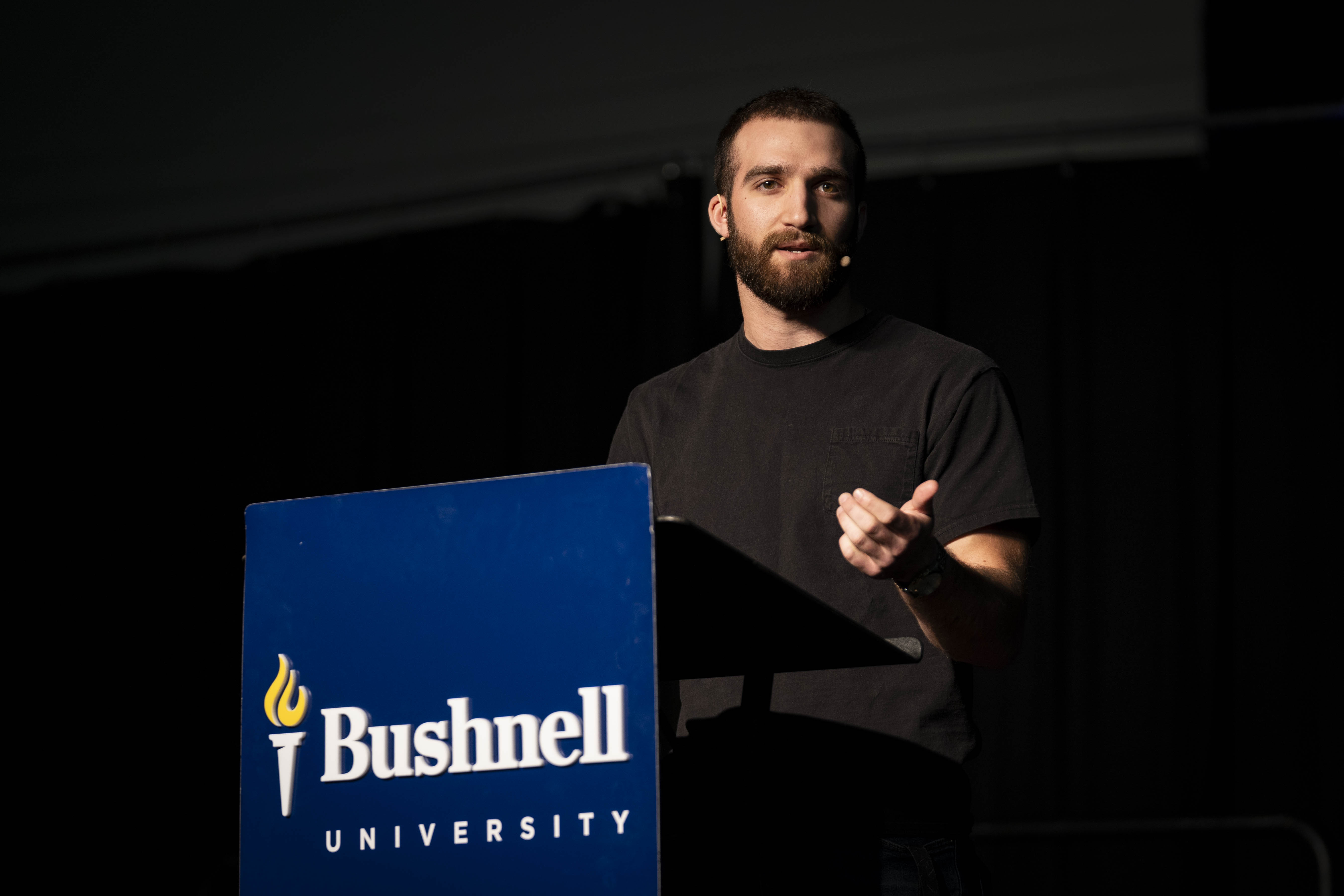 Student speaking at a Bushnell University campus event.
