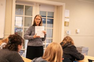 Bushnell University faculty member leading a Teacher Education class discussion with students.