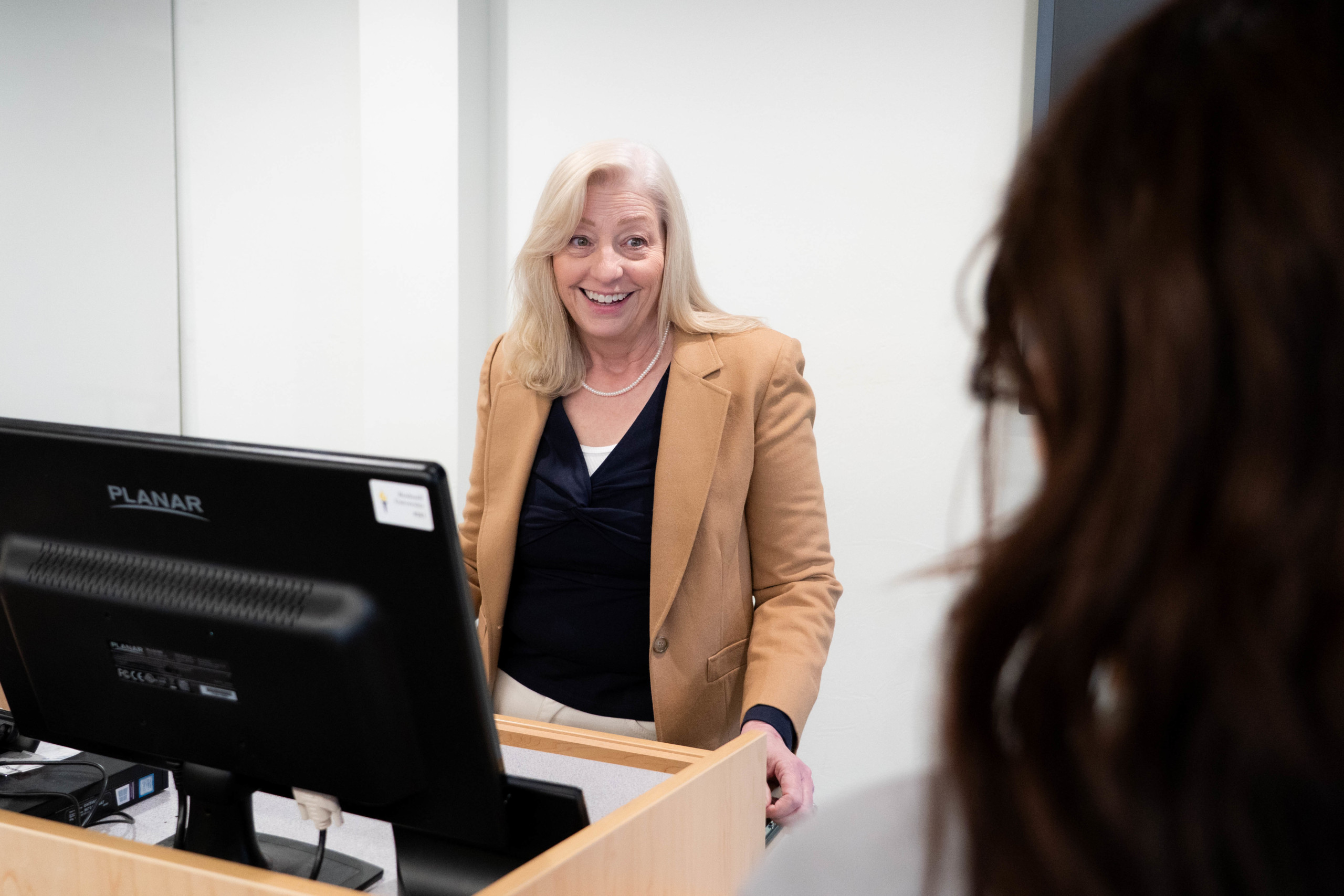 Bushnell University faculty member interacts with a student during class.