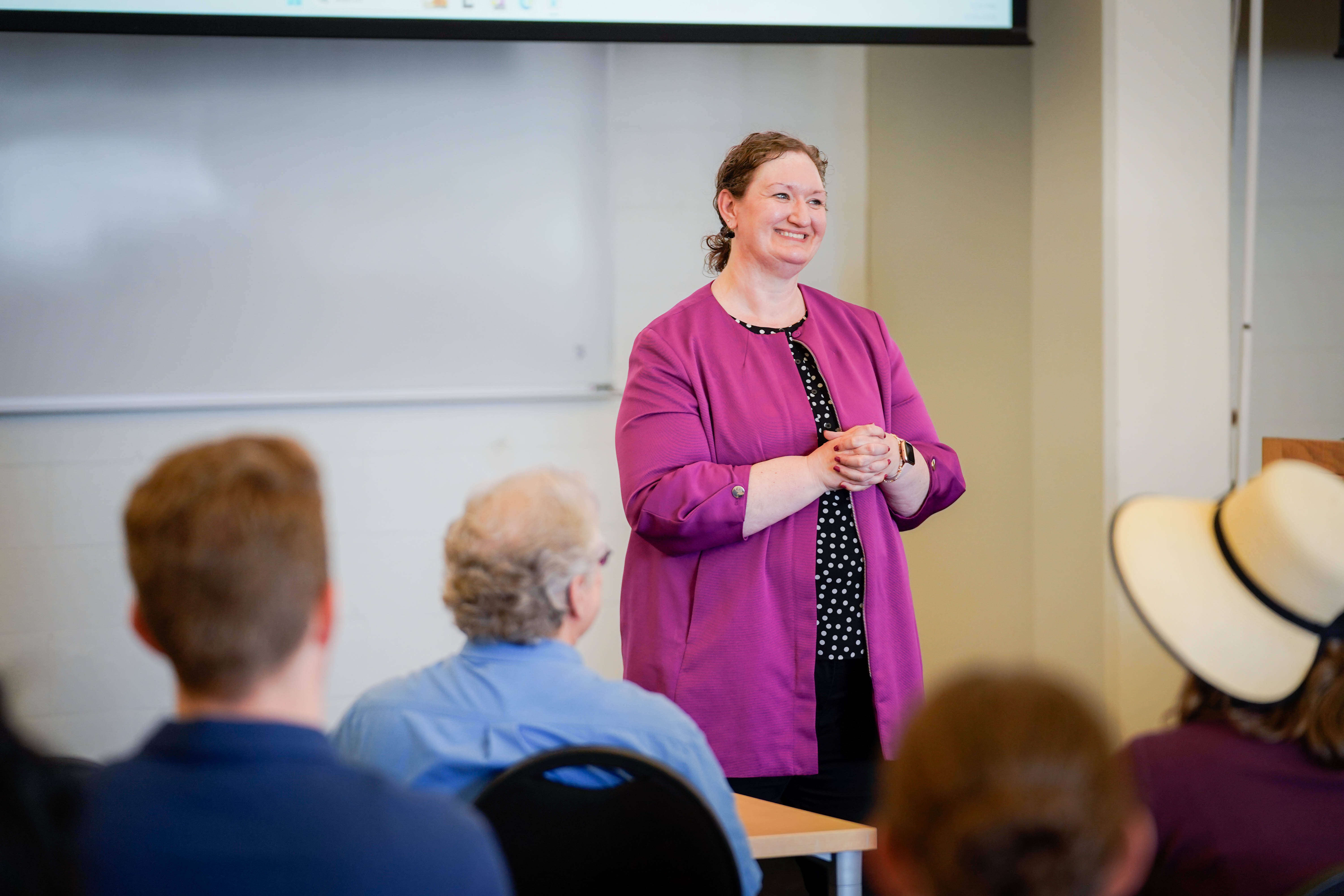 Bushnell University staff member leads a classroom discussion with faculty, staff, and students.