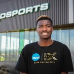 Portrait of college student in front of Kidsports community sports complex