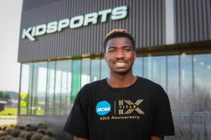 Portrait of college student in front of Kidsports community sports complex