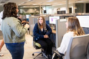 Students engage with workplace professionals while exploring career opportunities through hands-on learning experiences.