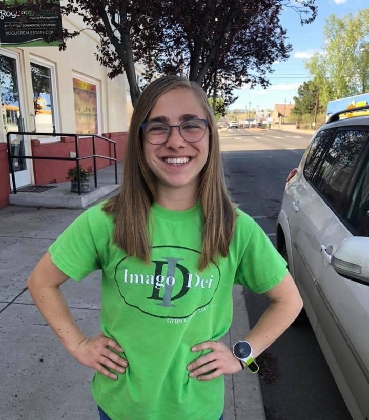 Casual photo of a female student athlete in a green shirt