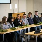 Communication students participating in a panel discussion during an event