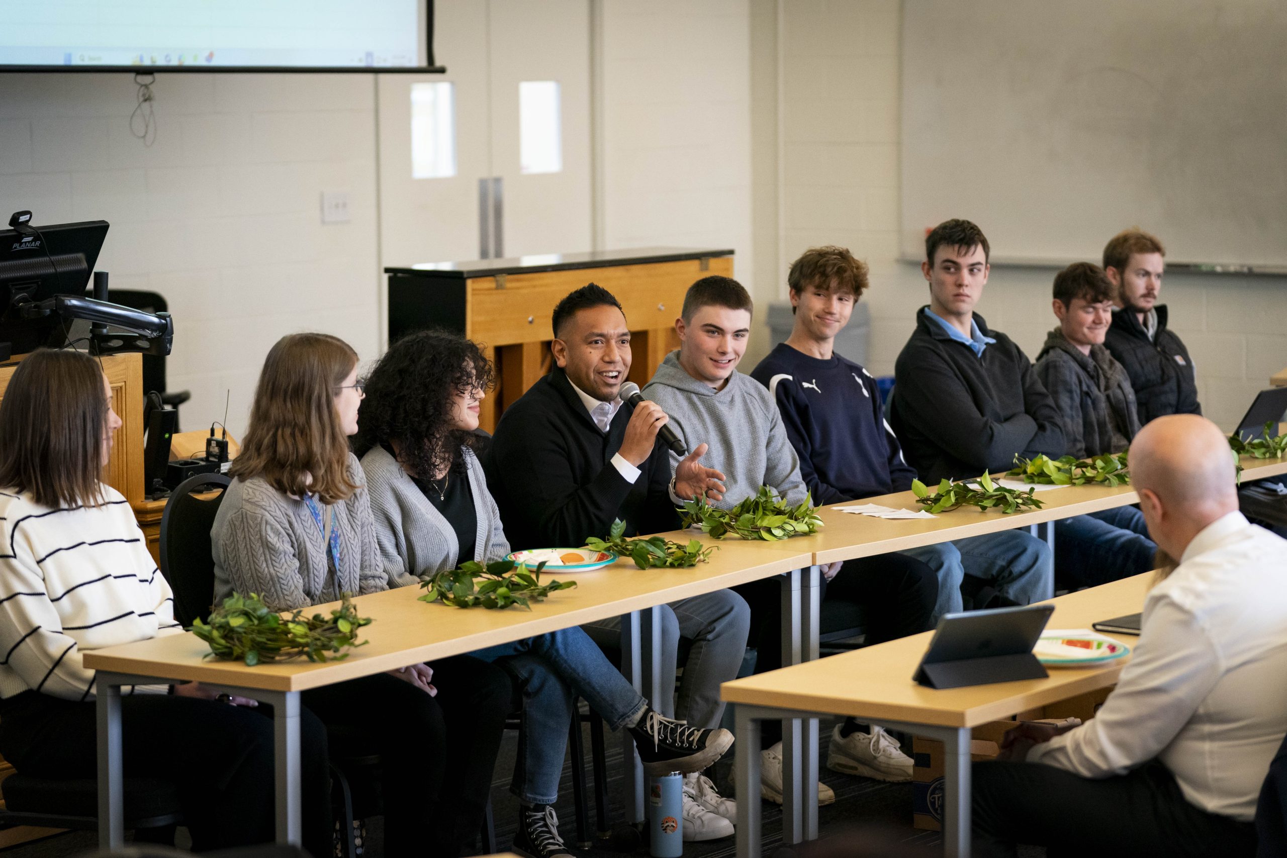 Communication students participating in a panel discussion during an event