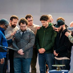 Bushnell ministry professors pray over graduating students