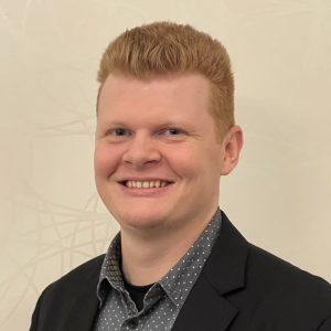 Headshot of an audio visual technician dressed professionally