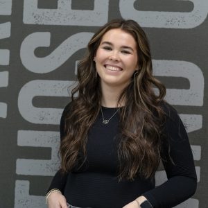 Young female student athlete with long brown hair