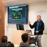 Student presenting their self-made video game code during class