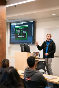 Student presenting their self-made video game code during class