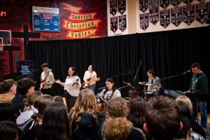 Worship band praises during music at a local high school in the Willamette Valley