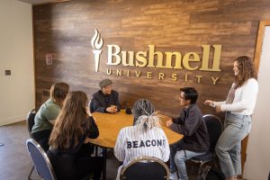 Bushnell University students participate in a small-group discussion with a guest speaker during an Honors Program gathering.