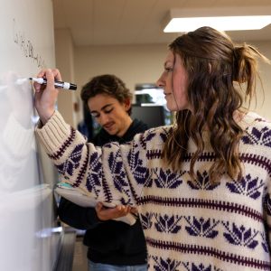 Bushnell University Students Collaborating on Classroom Project