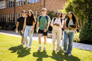 Group of Bushnell University undergraduate students walking across campus between classes.