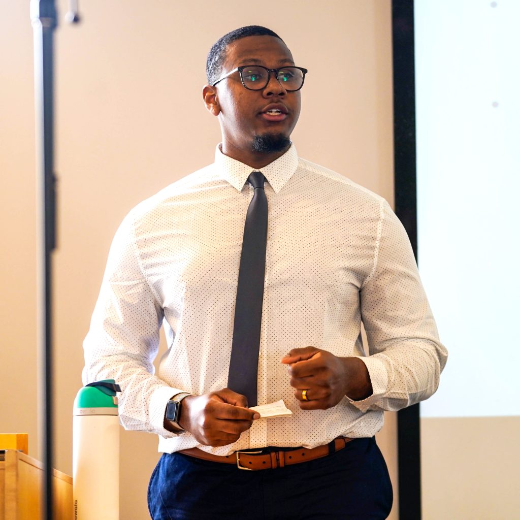 Student speaking during a classroom presentation at Bushnell University.