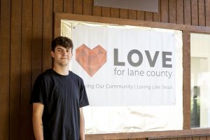 A Bushnell University student visits a Love for Lane County partner organization as part of a service and community engagement experience.
