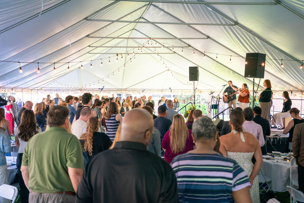 Students, families, faculty, and staff gather for worship during Bushnell University's Baccalaureate service.