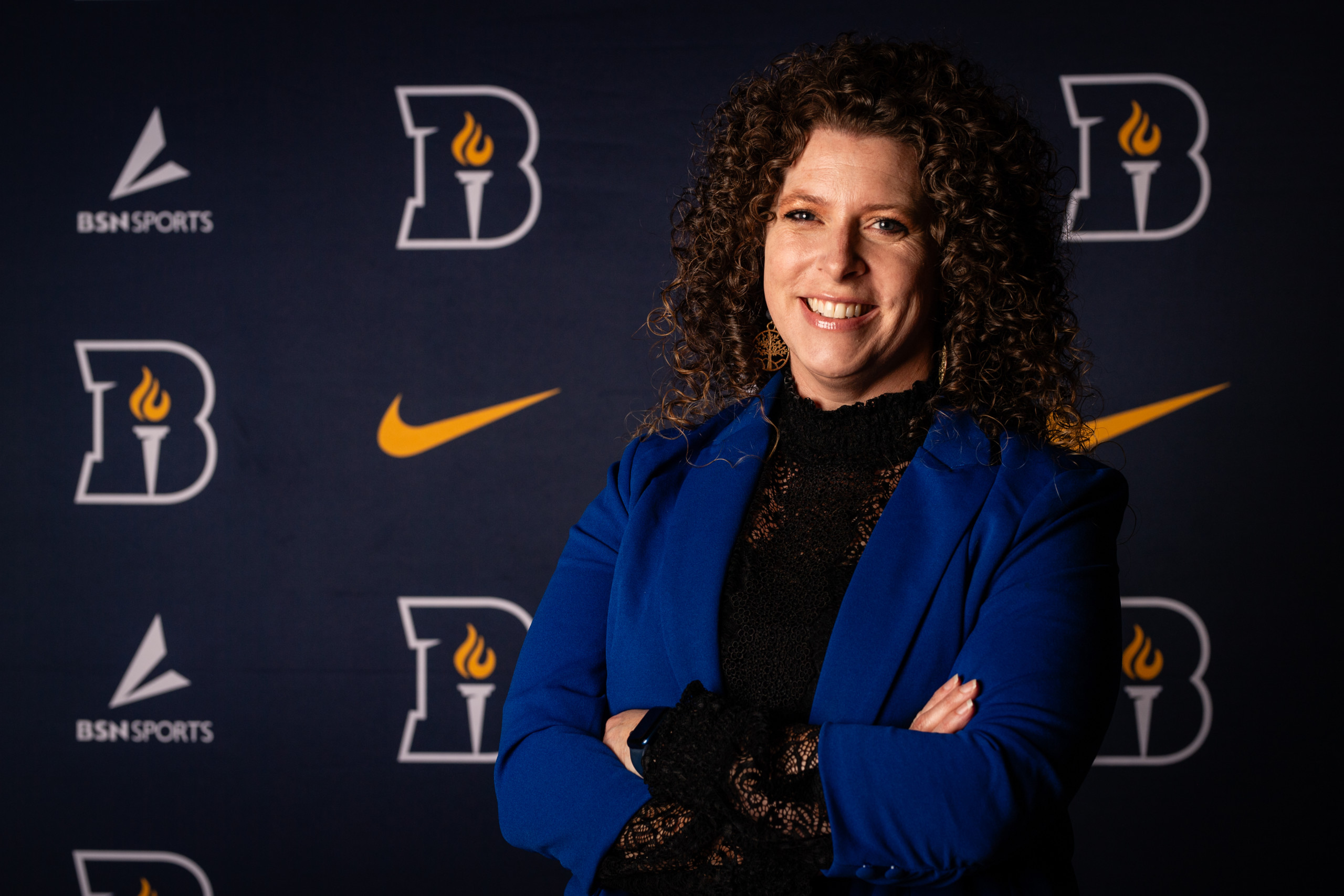 Bushnell University athletics staff member poses for a professional portrait.