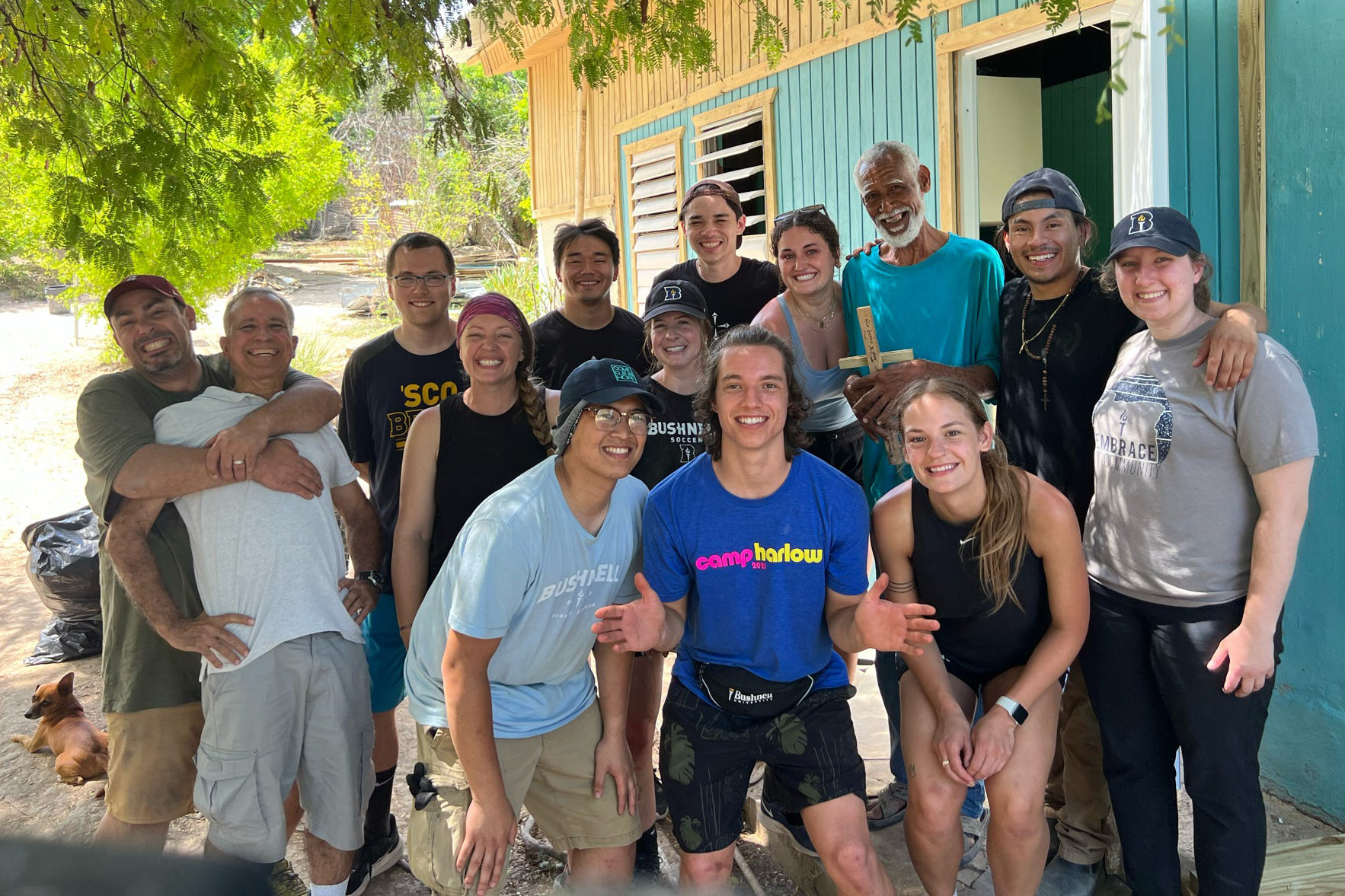Puerto Rico mission team posing with the man they helped build a house for.