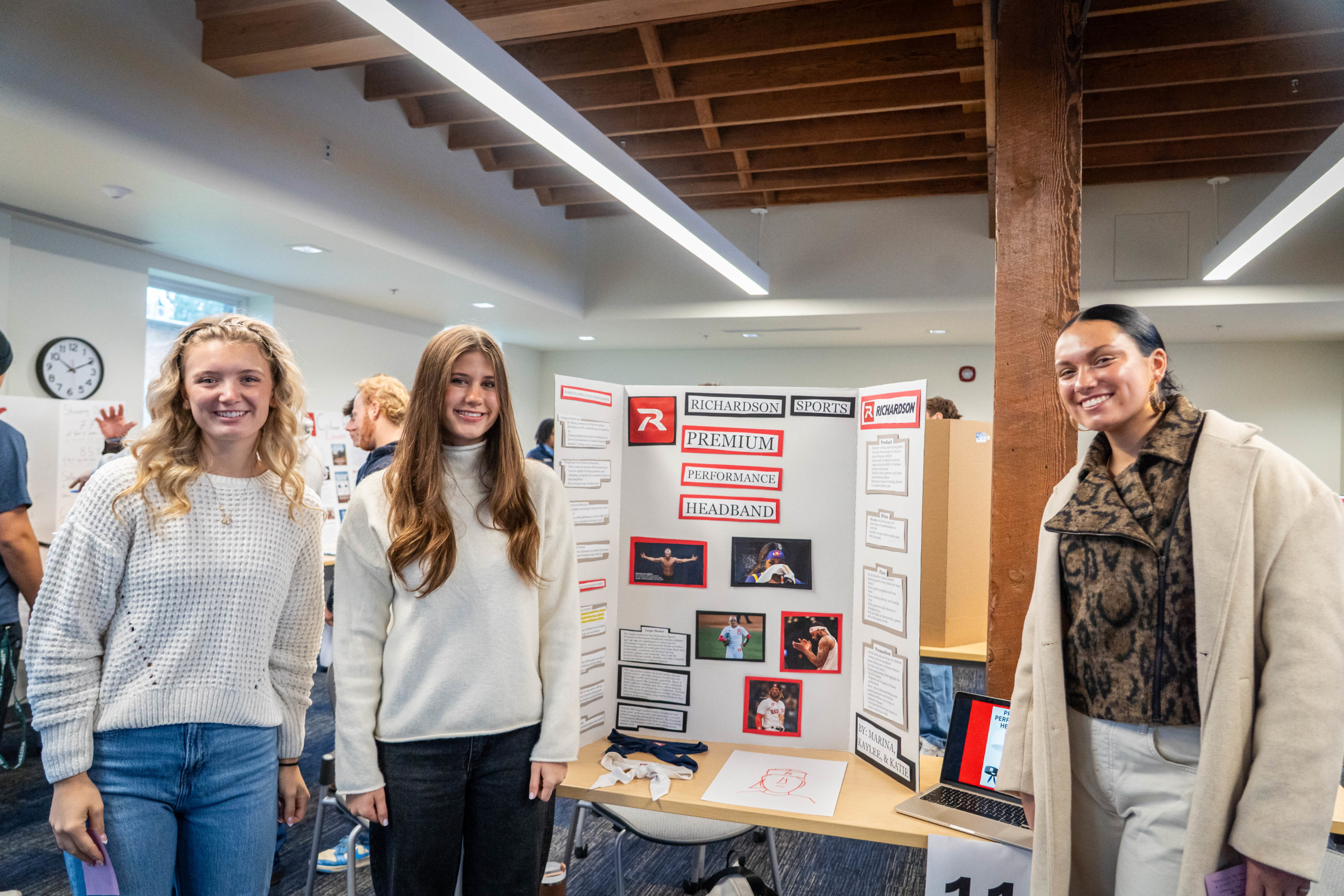 Bushnell University students present their sports marketing research project during a campus research showcase.