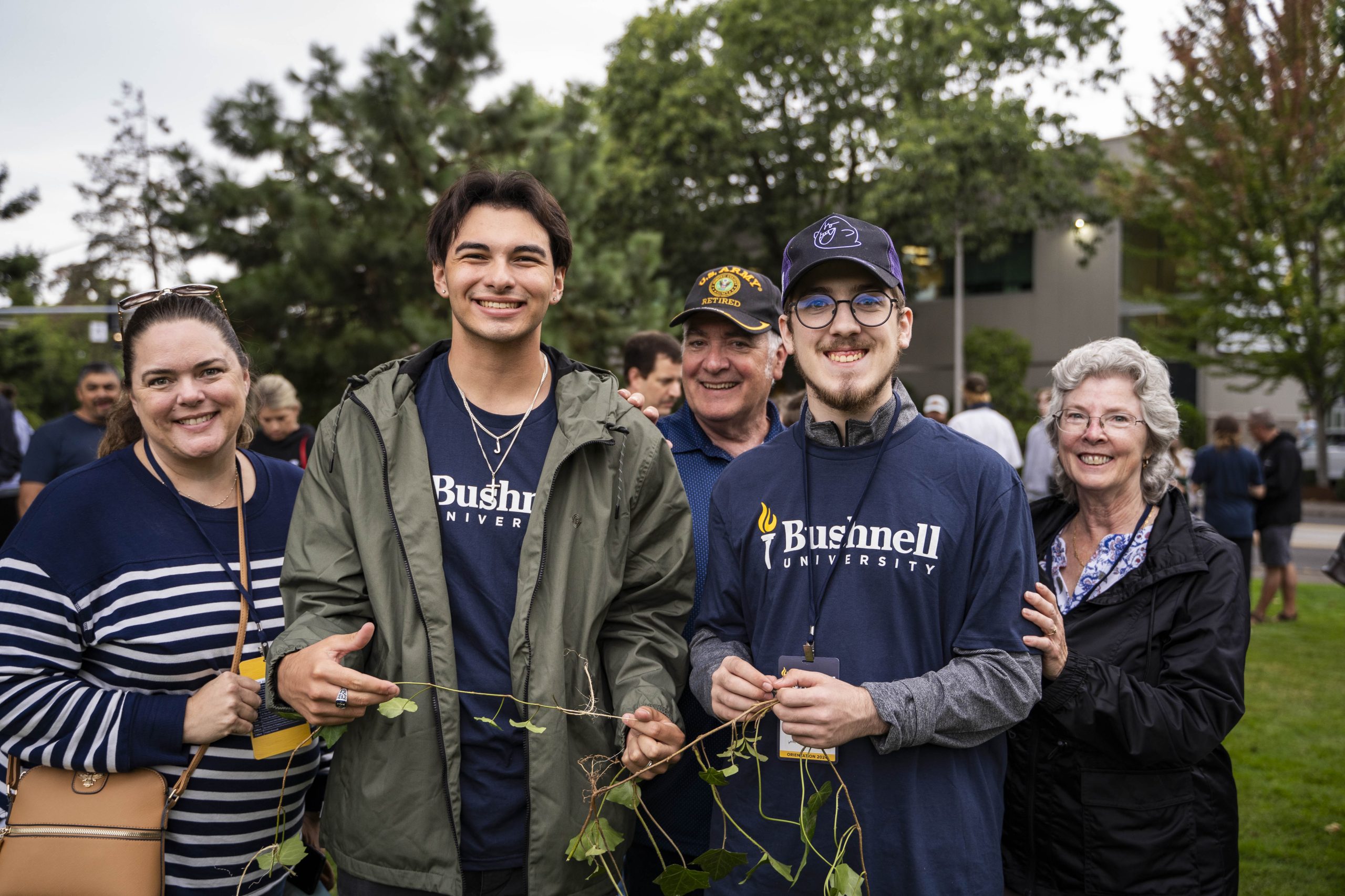 Bushnell University students and family members gather together during a campus event.
