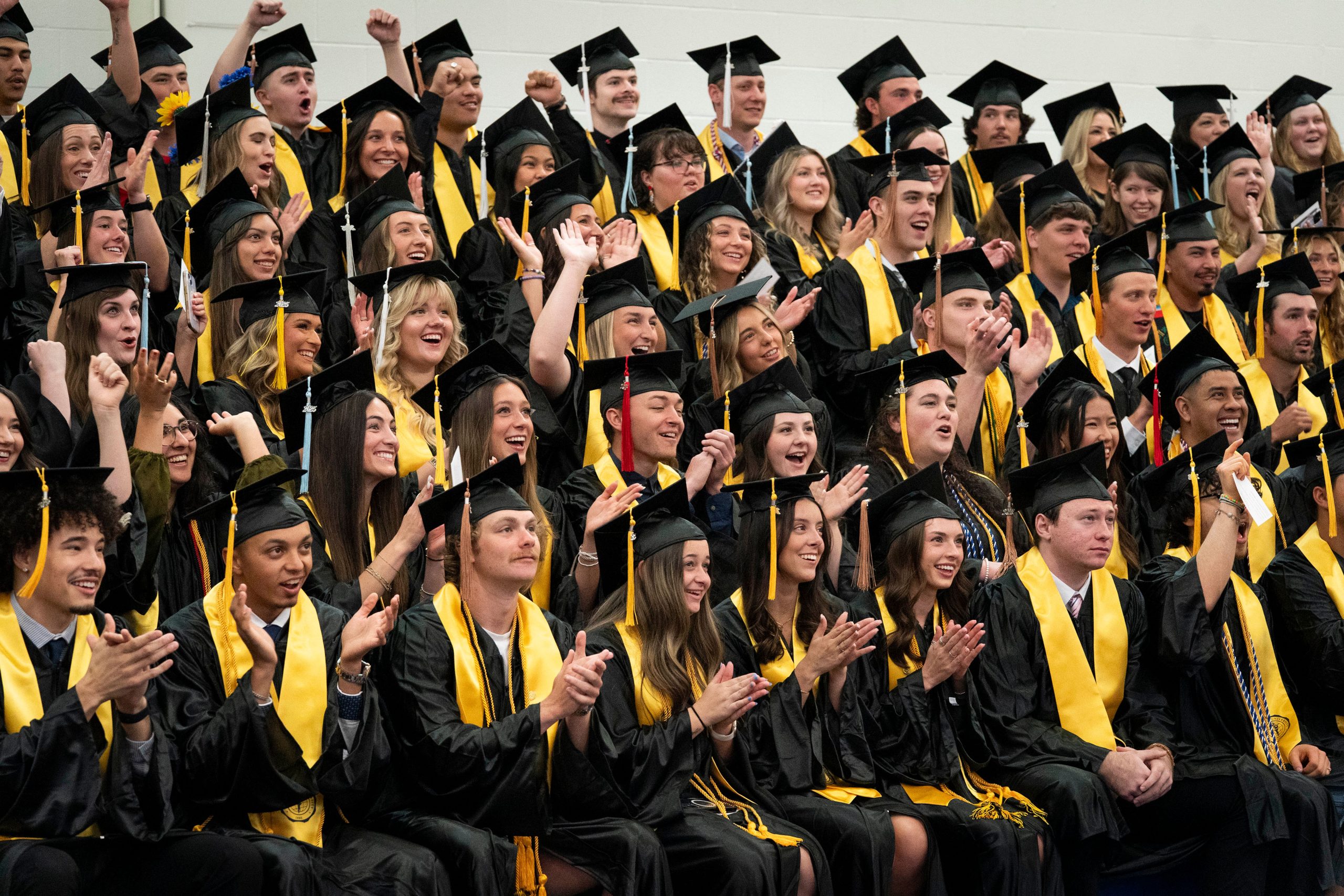 Bushnell University graduates gather for a class photo before the commencement ceremony.