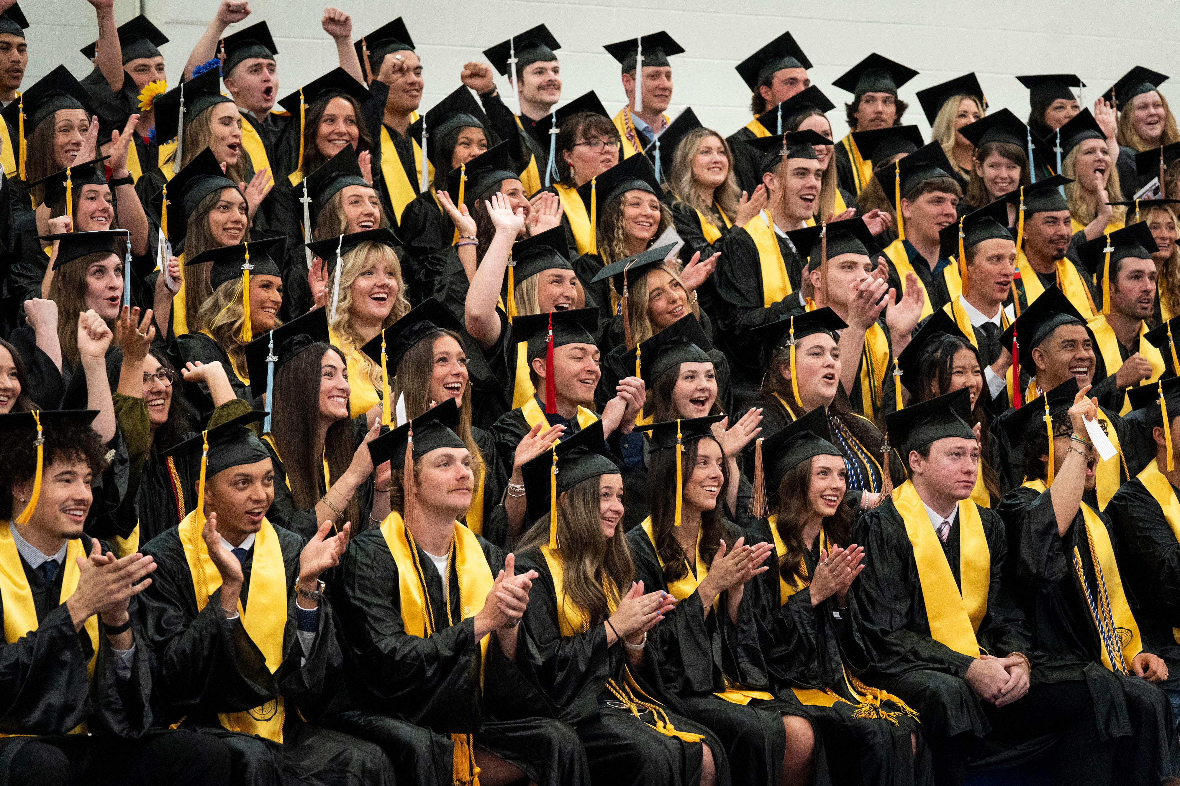 Bushnell University graduates gather for a class photo before the commencement ceremony.