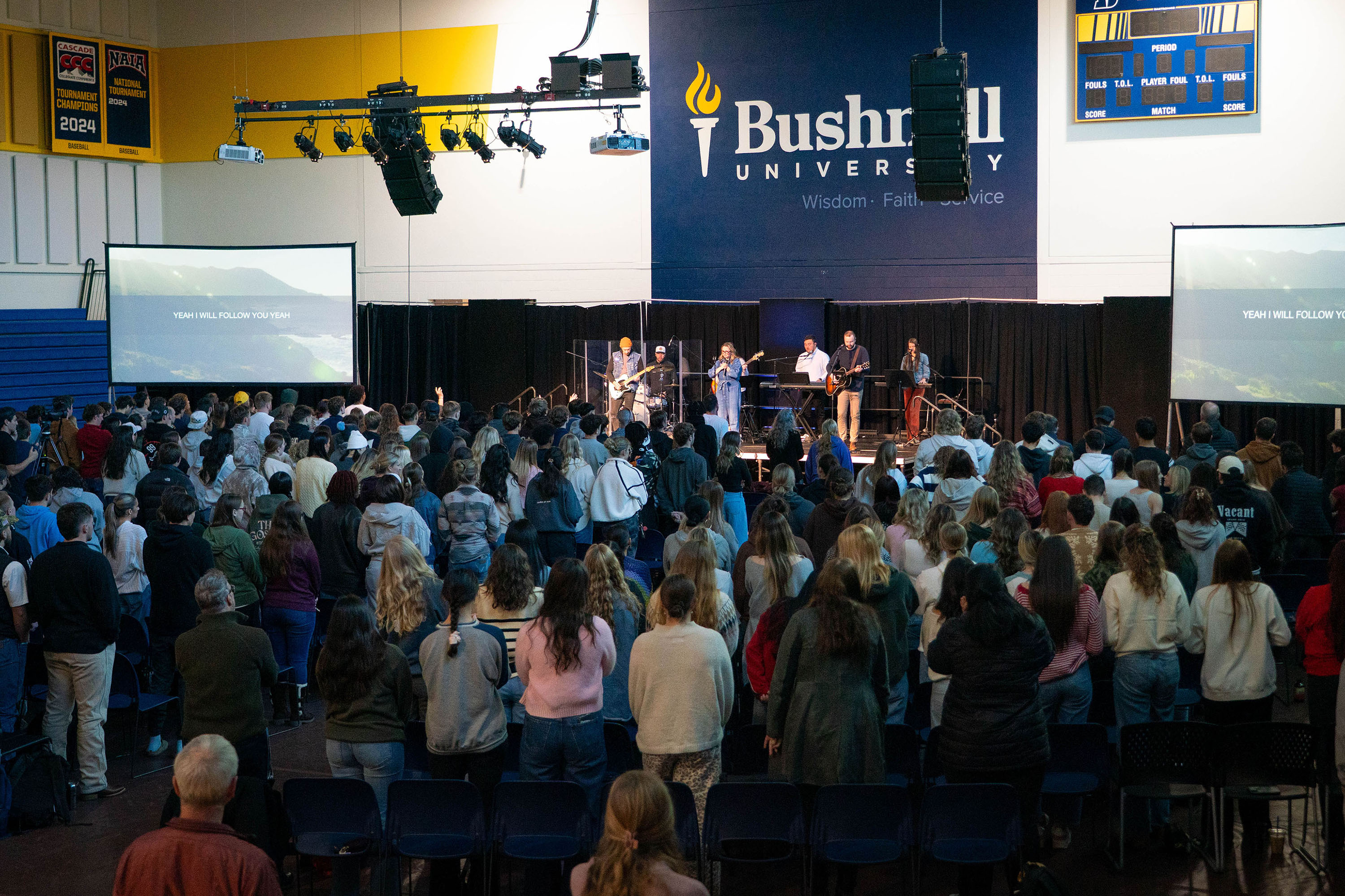 Overhead photo of a large crowd of Bushnell students and staff with worship band on stage during Chapel.