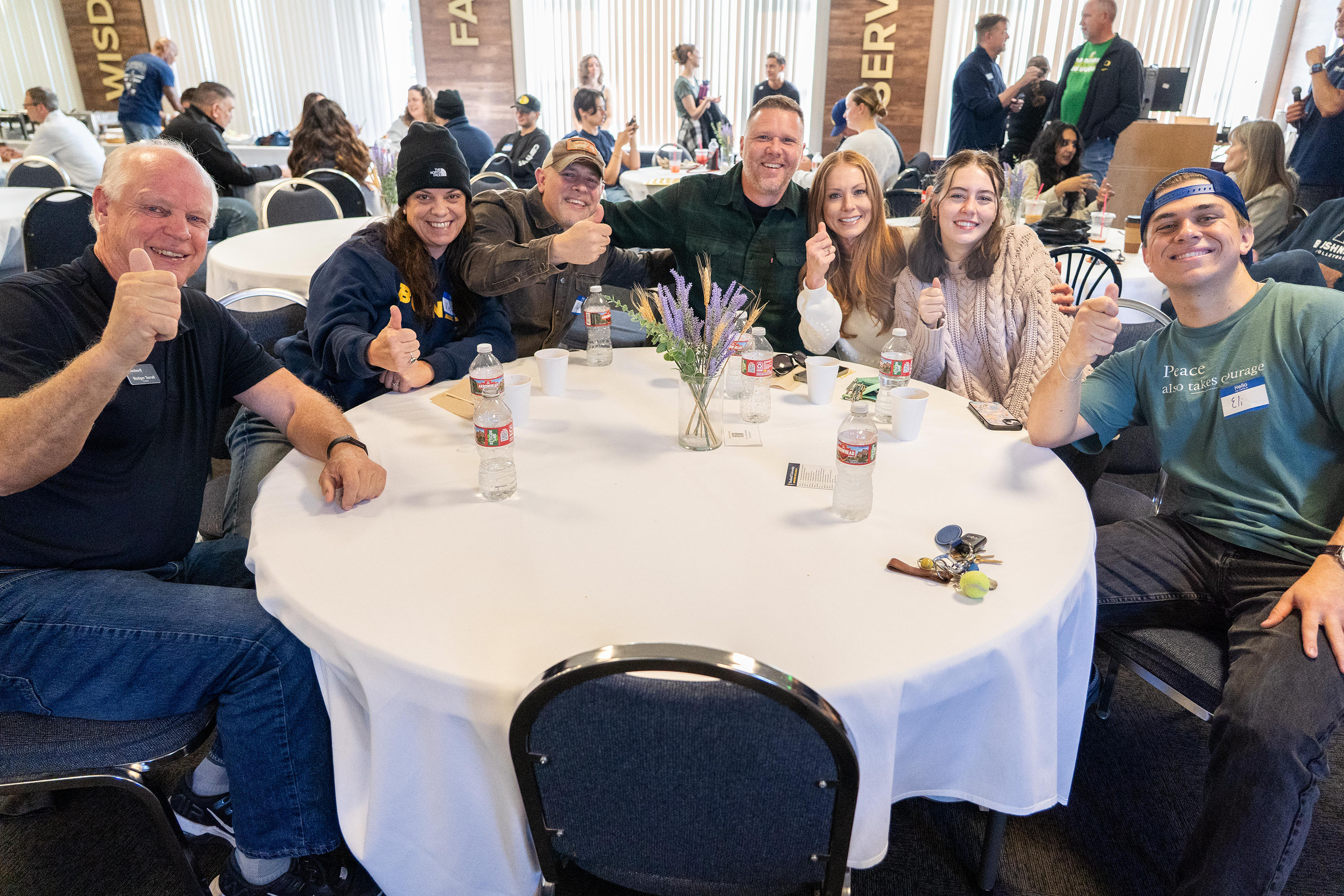 Multiple parents and children gathering during Bushnell Family weekend.