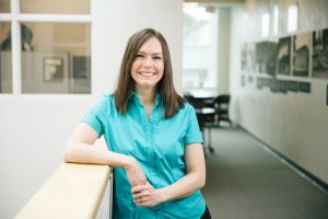student smiling in the Bushnell University School of Education building.
