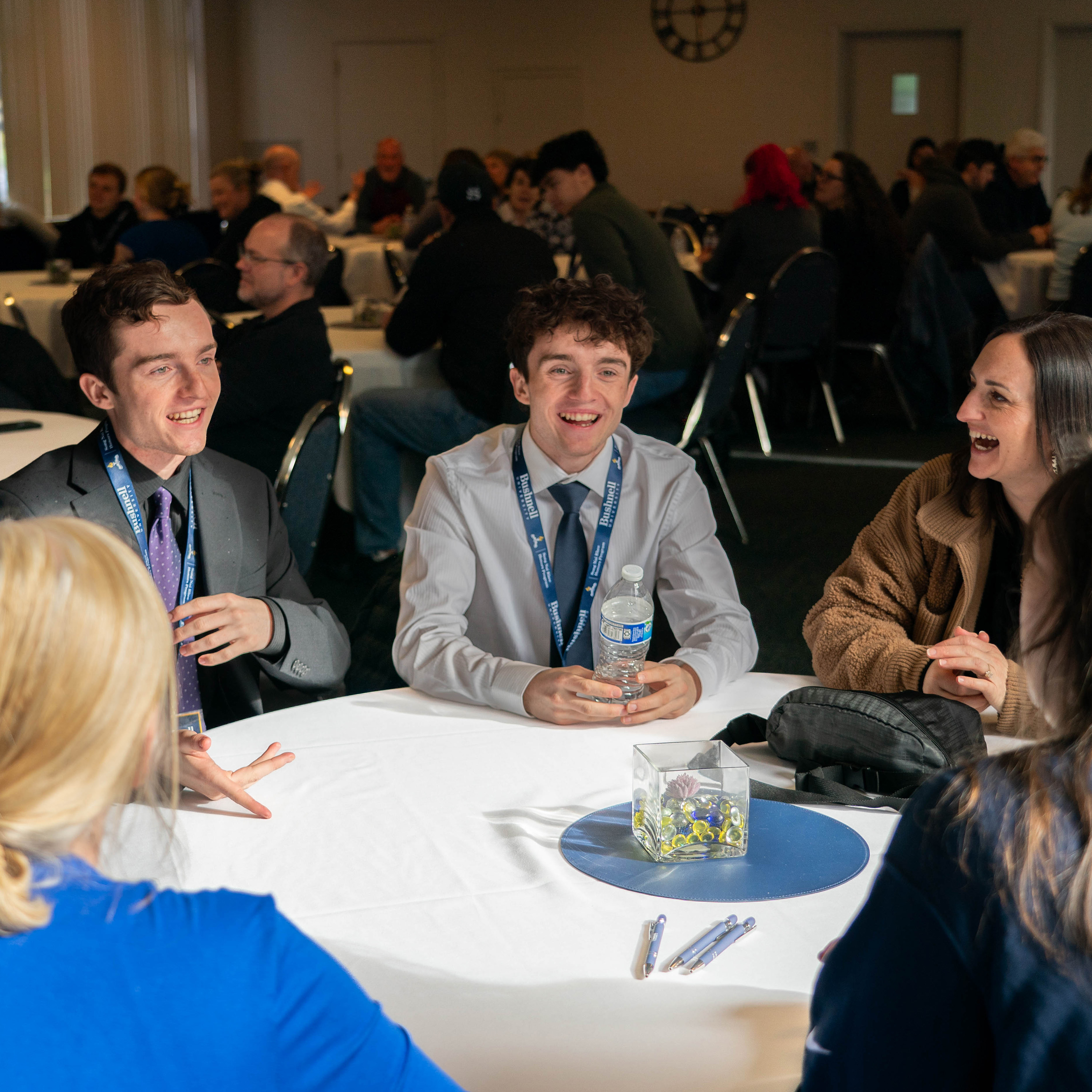 Professionally dressed students at the Song Nai Rhee Honors Scholarship Competition connect with Bushnell staff