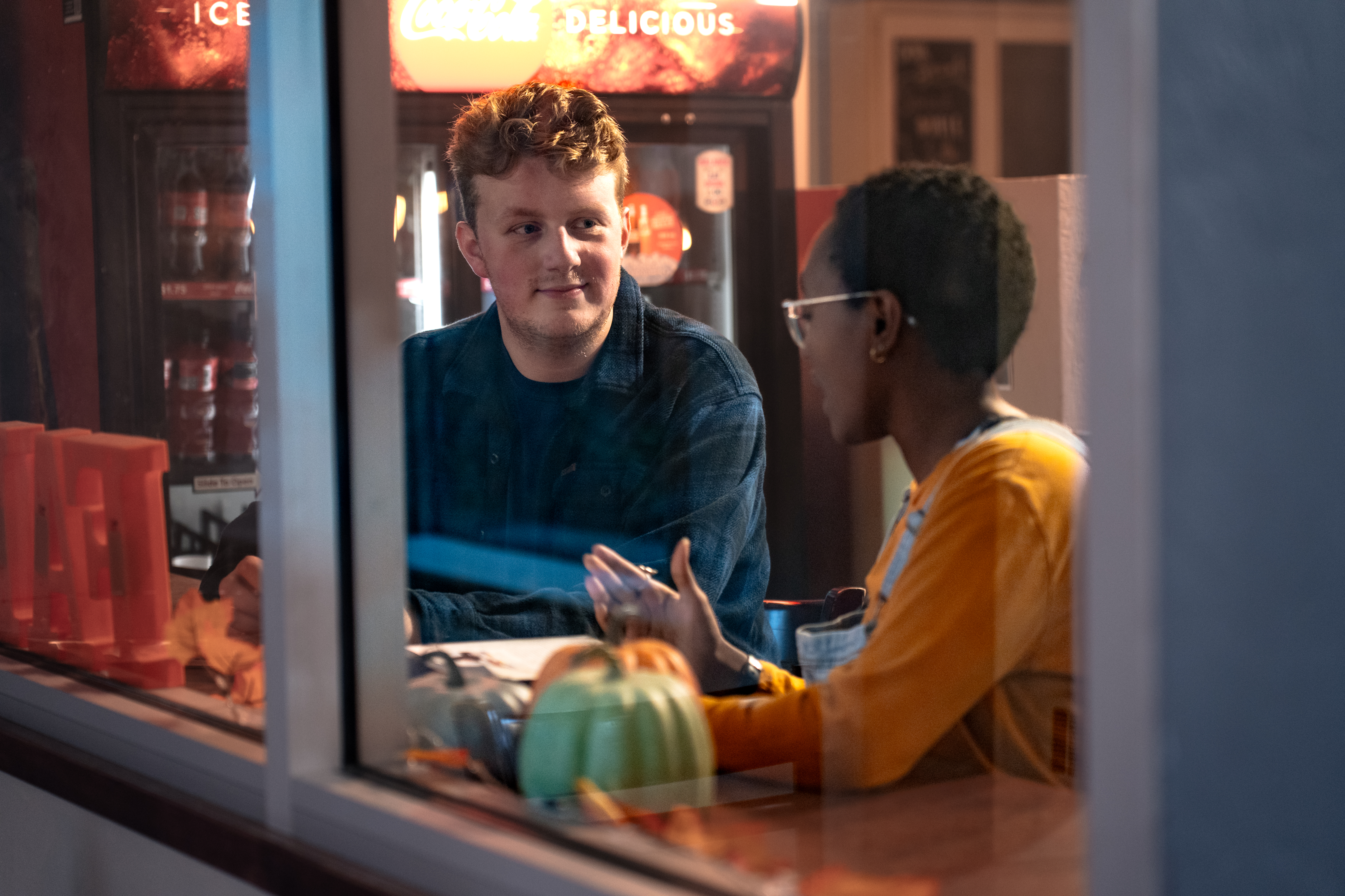 A student tutor assists another student in need of homework help.