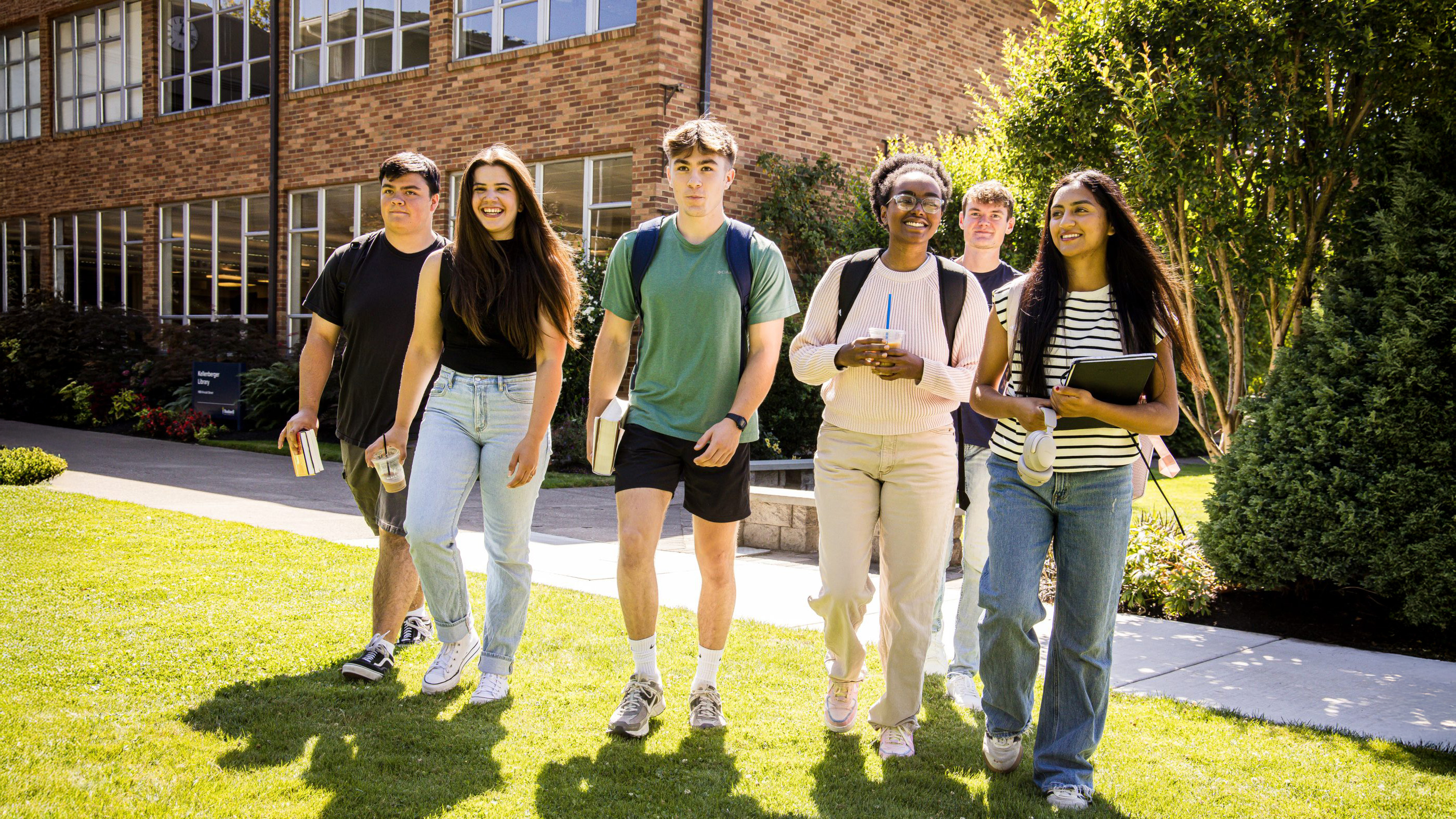 Group of Bushnell students walking across campus
