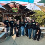 Bushnell University students and staff pose together while volunteering during Embrace the Community Day.