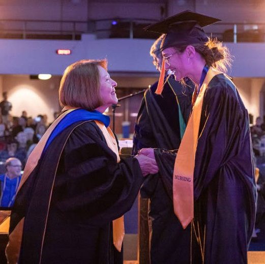 Bushnell University graduates celebrating at commencement