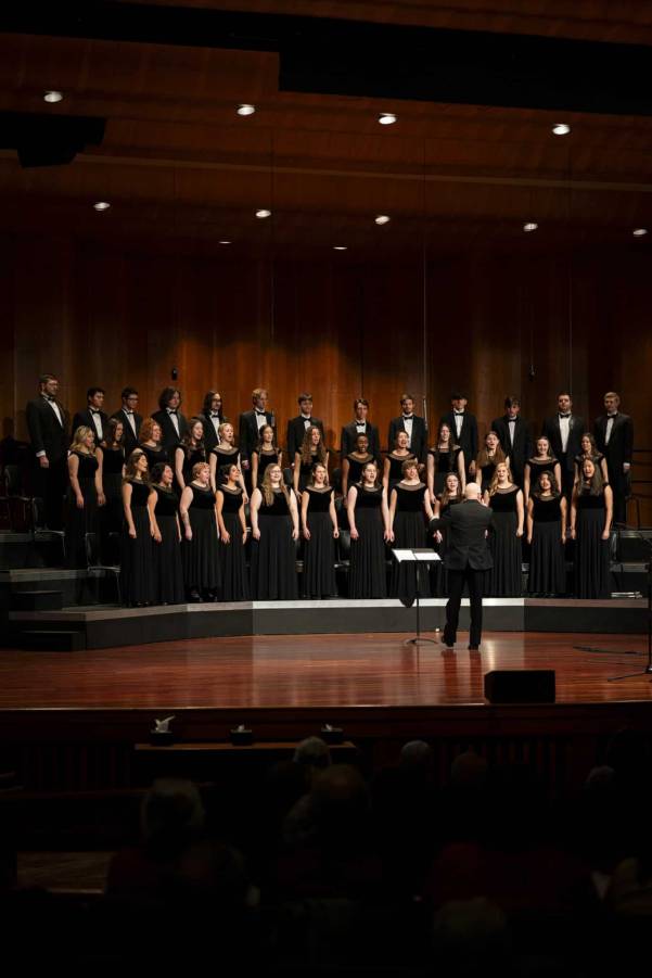 Group of students singing on stage at Christmas concert