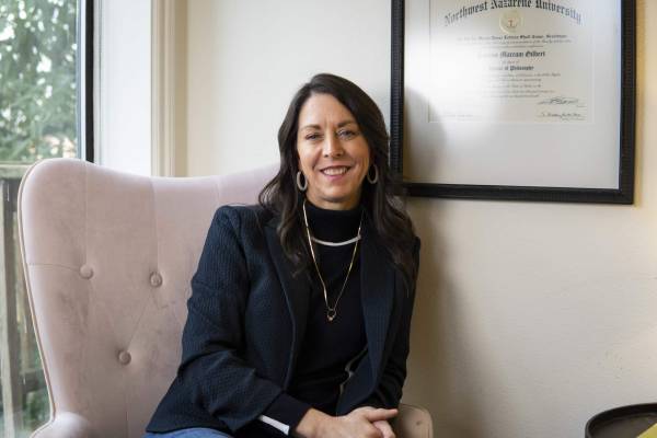 Woman sitting in chair in office