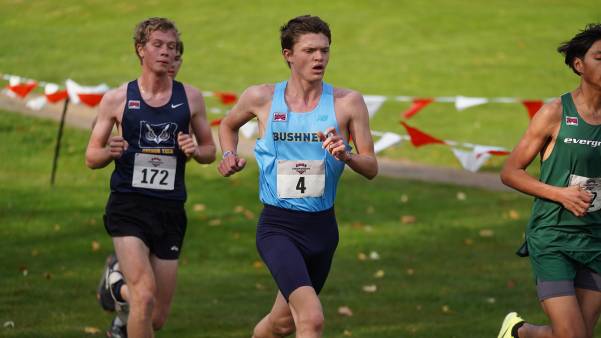 Male student runner at cross country meet